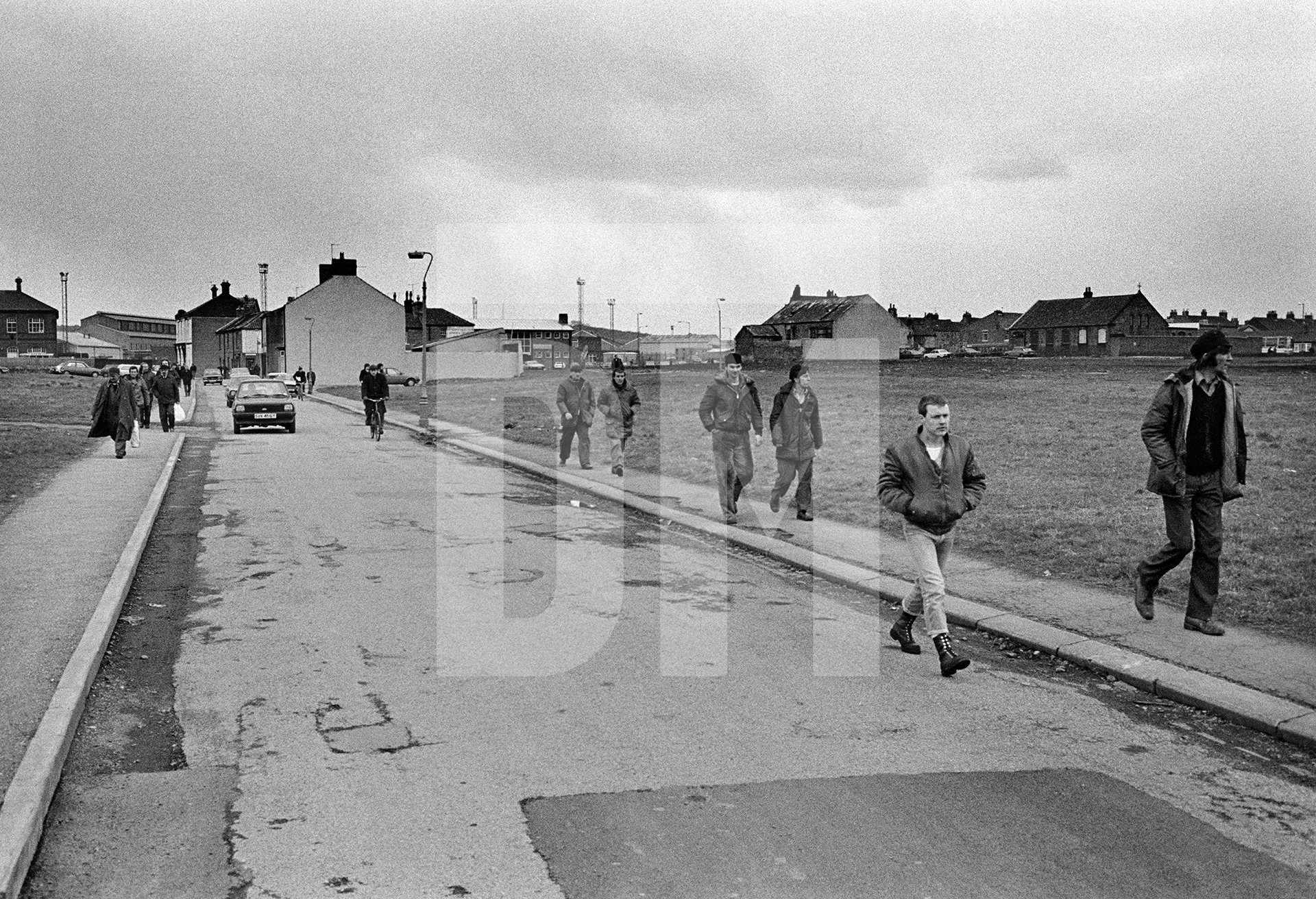 Workers on their way toShildon Wagon Works, Spennymoor, Co. Durham. March 1983 by Daniel Meadows