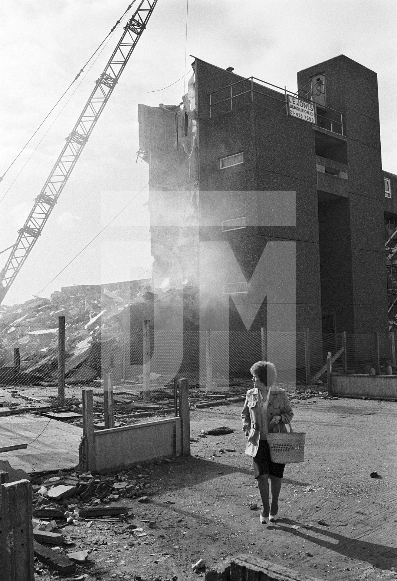 Life goes on while demolition takes place, Bessemer Park, Spennymoor, Co. Durham. February 1983 by Daniel Meadows