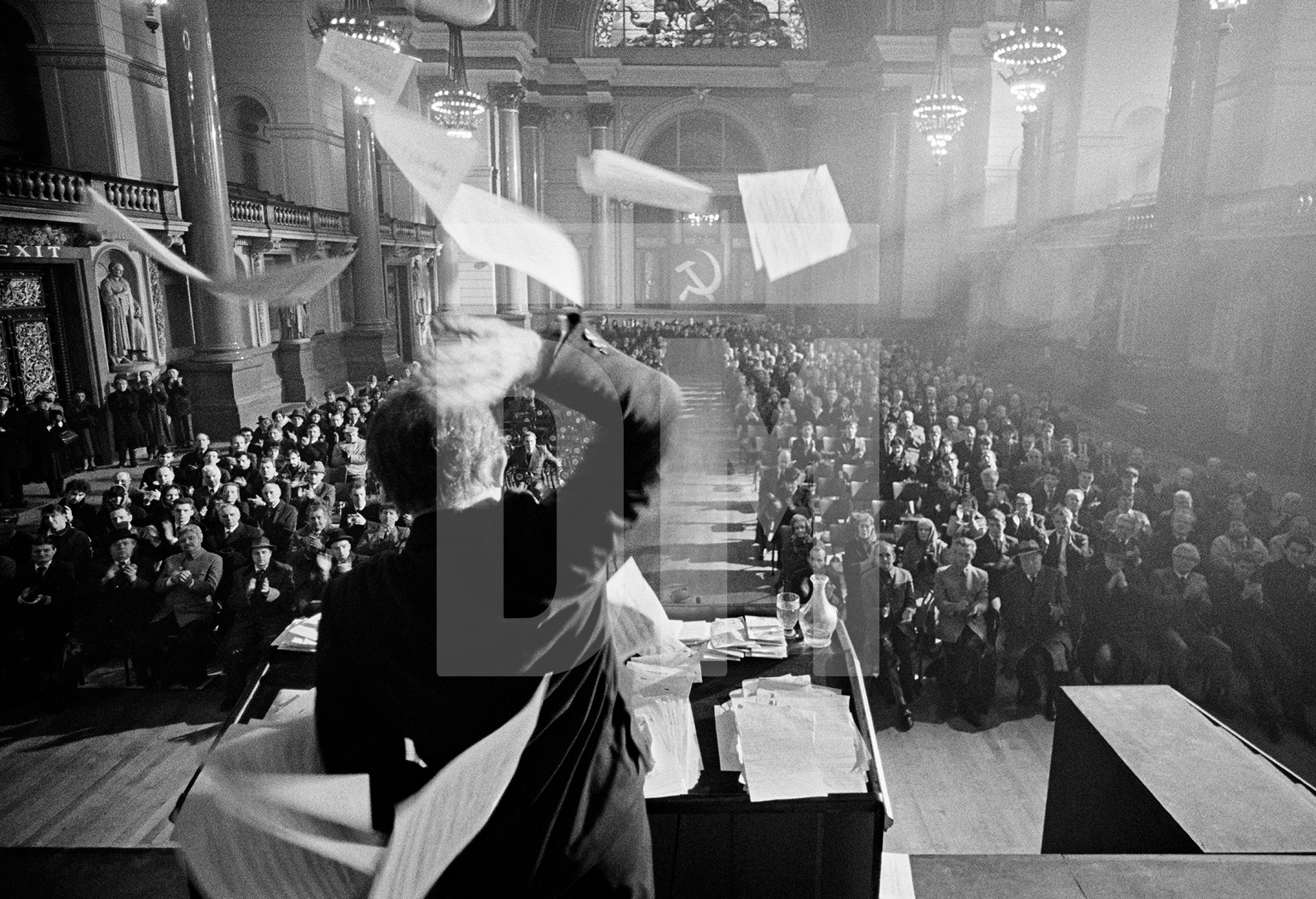 John Shrapnel [Zhdanov] denounes Shostakovich from the podium in Moscow, January 1948. Location: St. George’s Hall, Liverpool.  February 1987 by Daniel Meadows