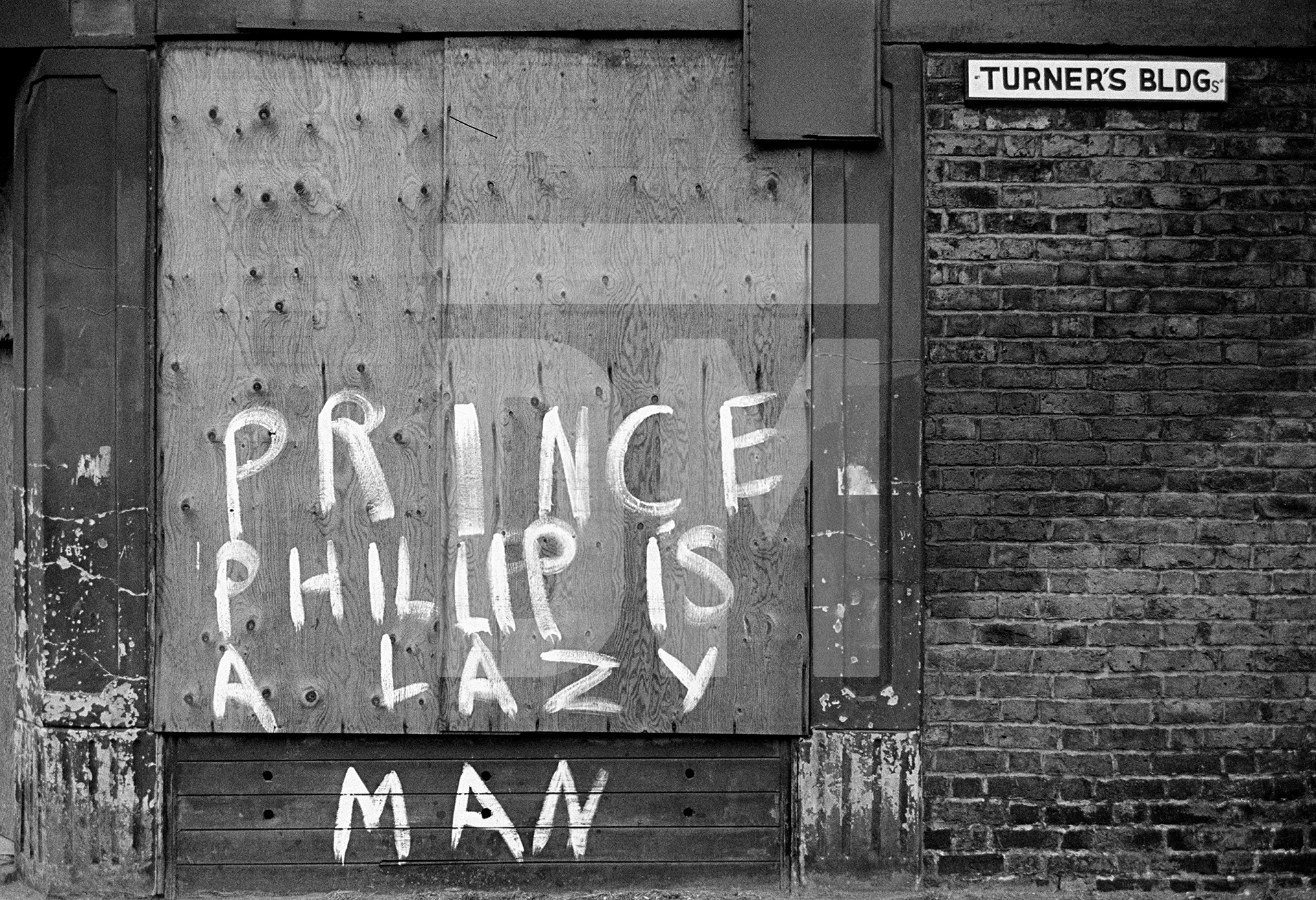 ‘Prince Phillip is a Lazy Man’, graffiti on derelict house, Salford. July 1978 by Daniel Meadows