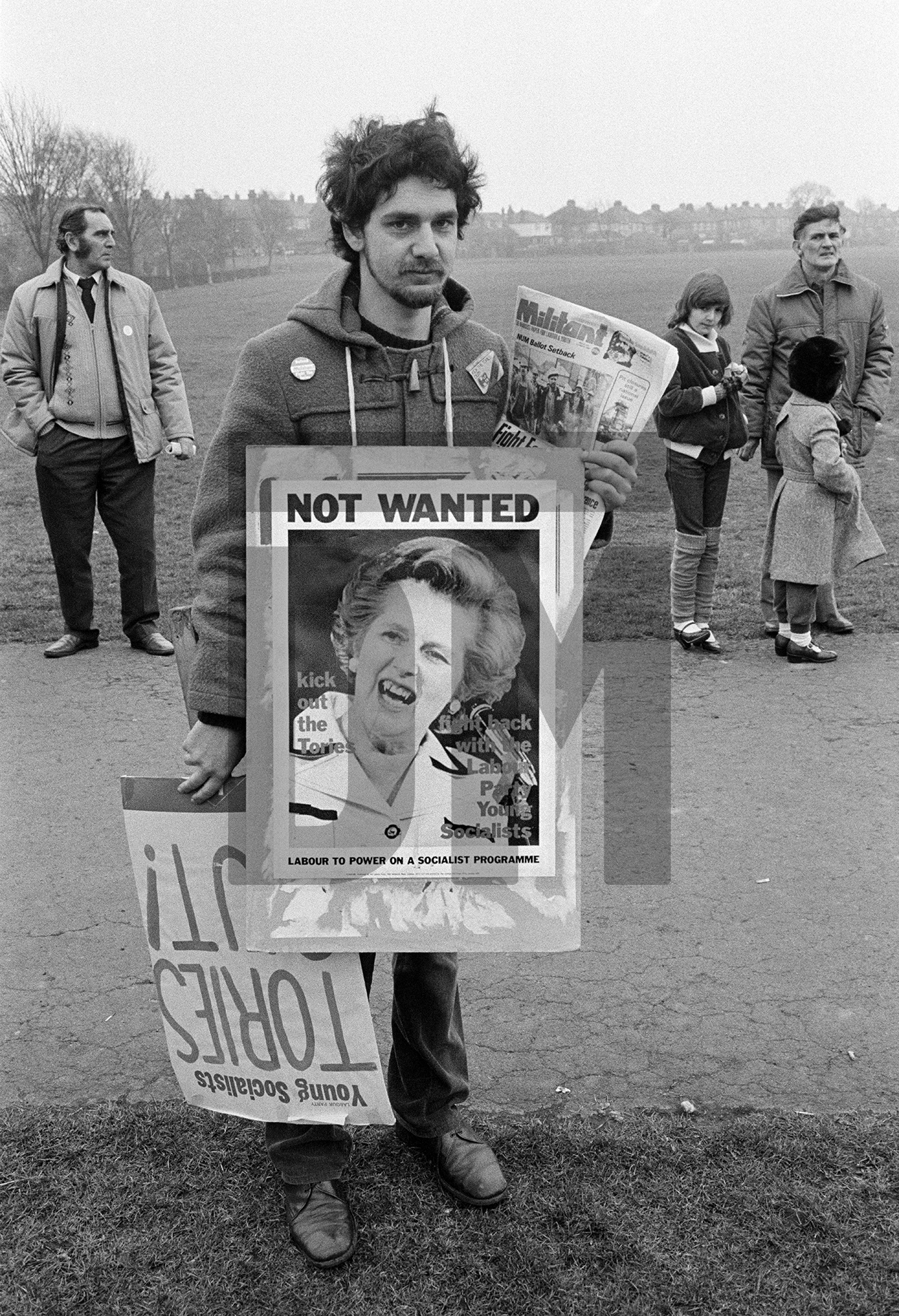 Militant (newspaper) seller at demonstration against the closure of Shildon Wagon Works, Darlington. 12 March 1983 by Daniel Meadows