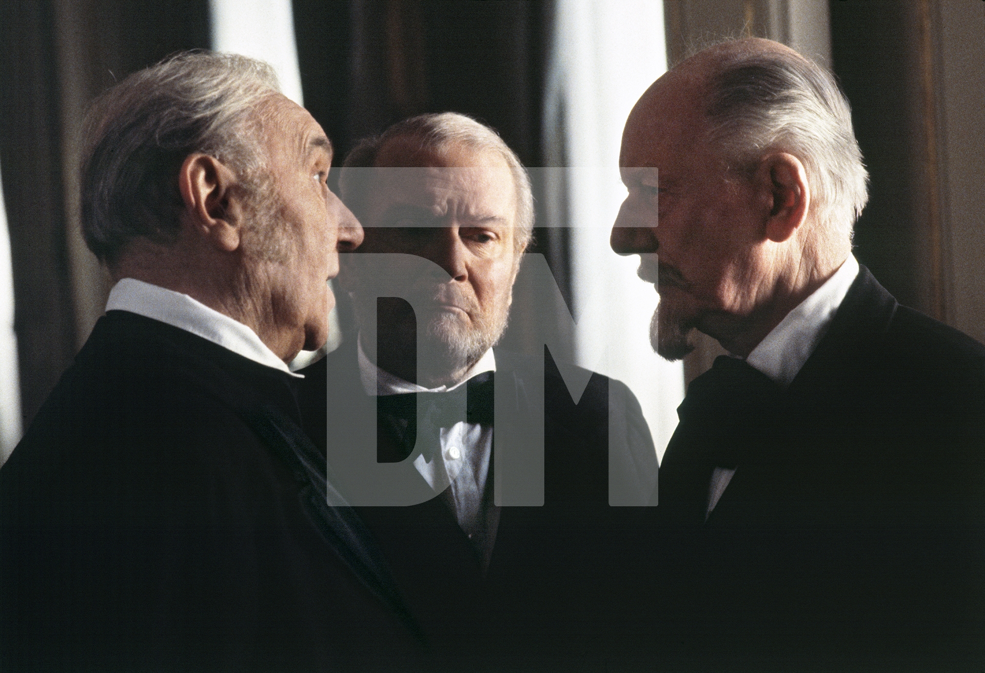 Sir Ralph Richardson [Pfordten], Lord Olivier [Pfeufer], Sir John Gielgud [Pfistermeister] officials at the court of ‘mad’ King Ludwig II of Bavaria, on set at the Hofburg Palace, Vienna. January 1982 by Daniel Meadows