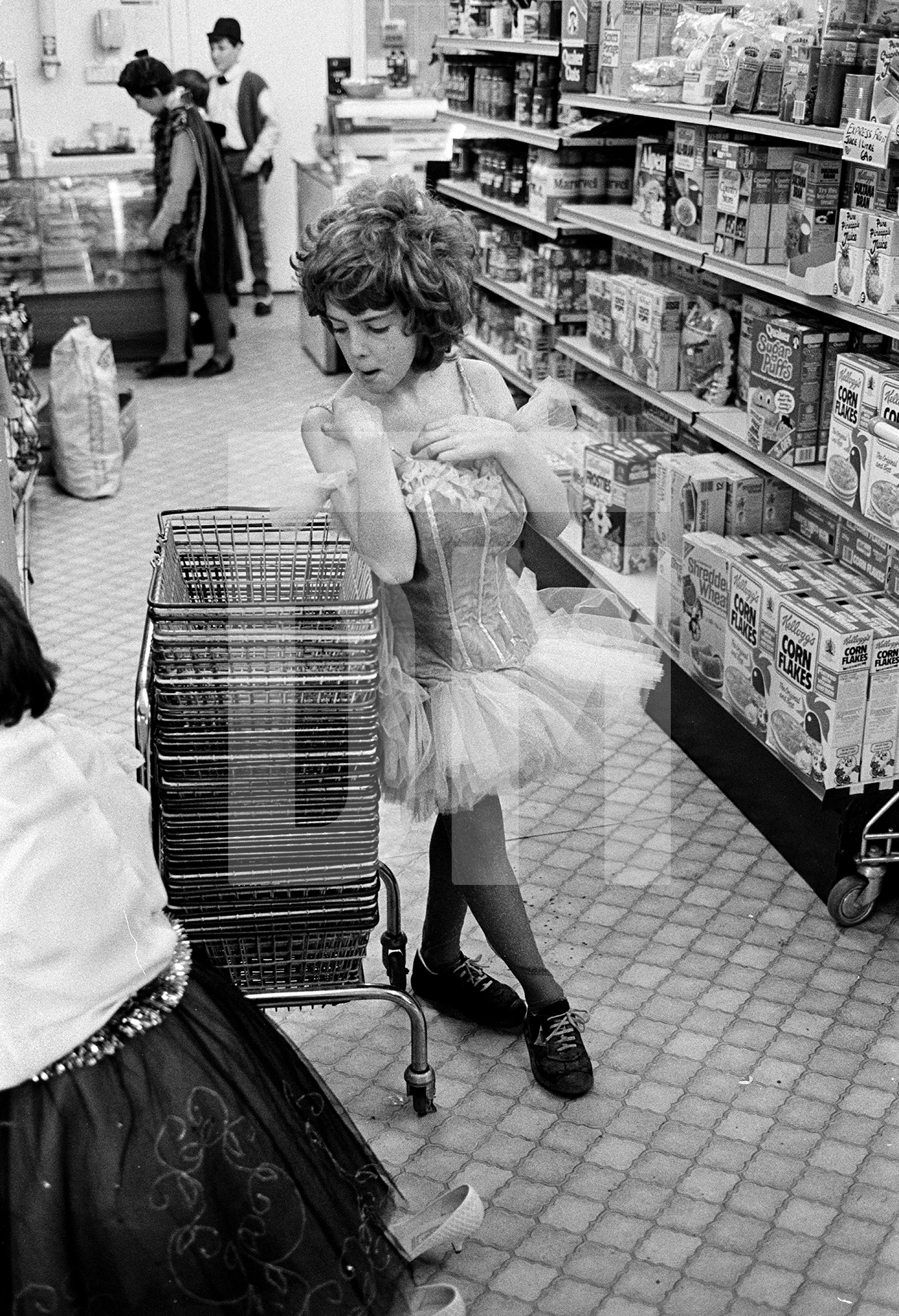 Fancy Dress Christmas shopping, Bromley. December 1984 by Daniel Meadows