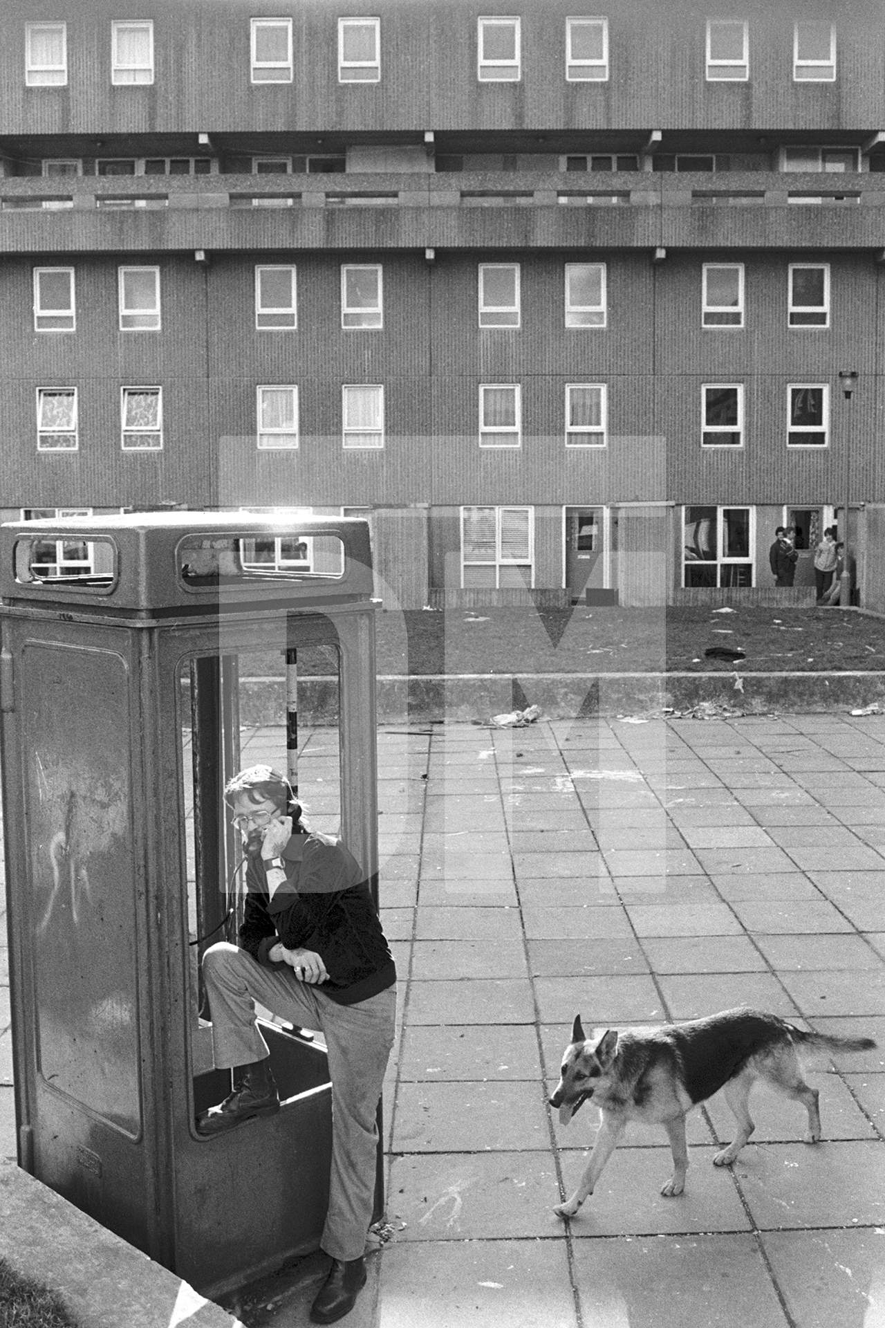 Life goes on while demolition takes place, Bessemer Park, Spennymoor, Co. Durham. February 1983 by Daniel Meadows